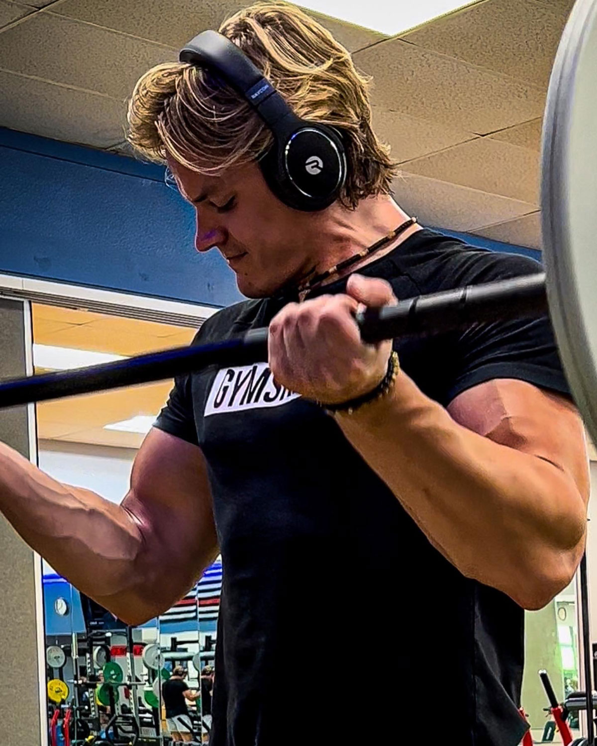 Liam Canard excercising with weights